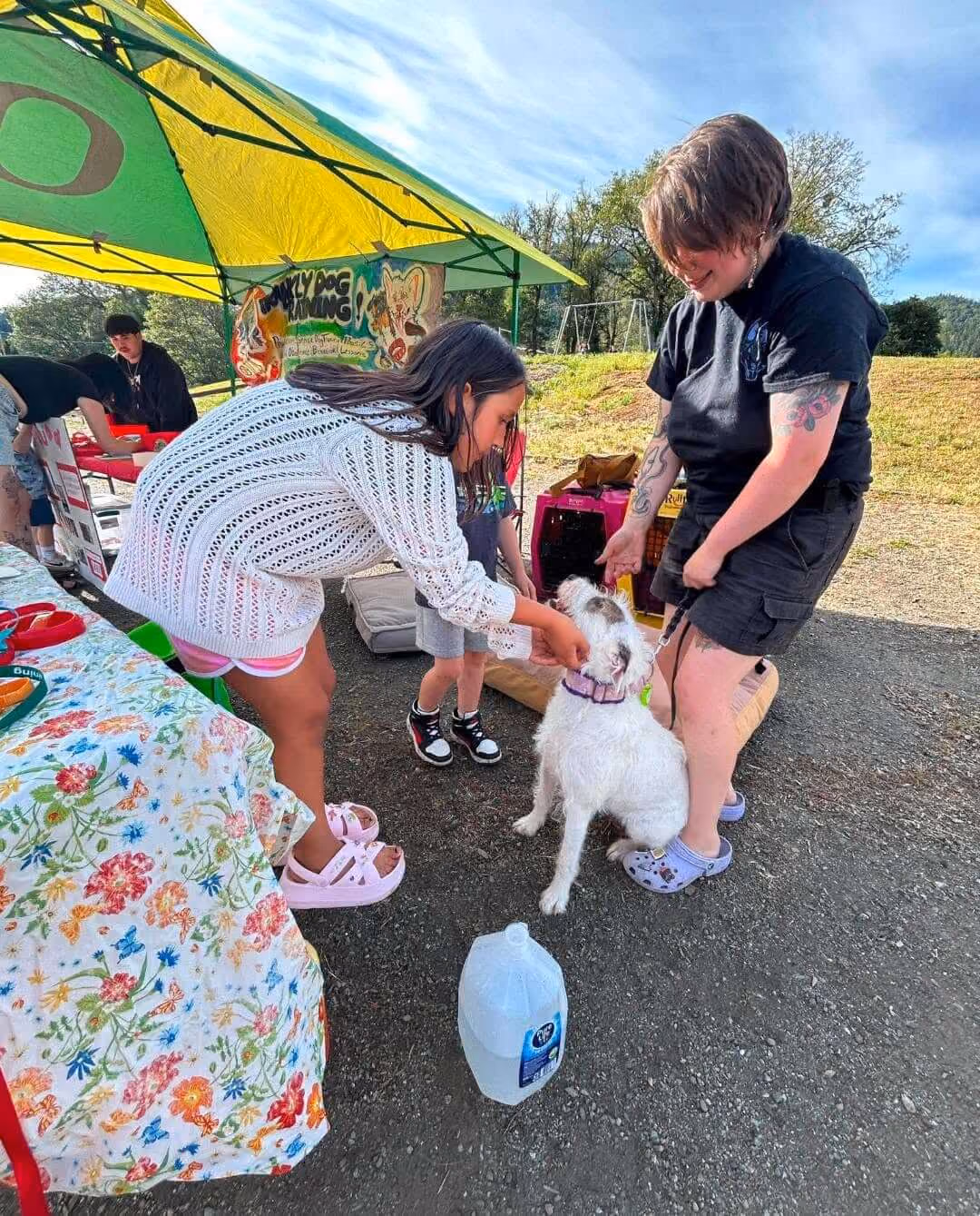 Frankly Dog Training therapy dog booth at a public event.