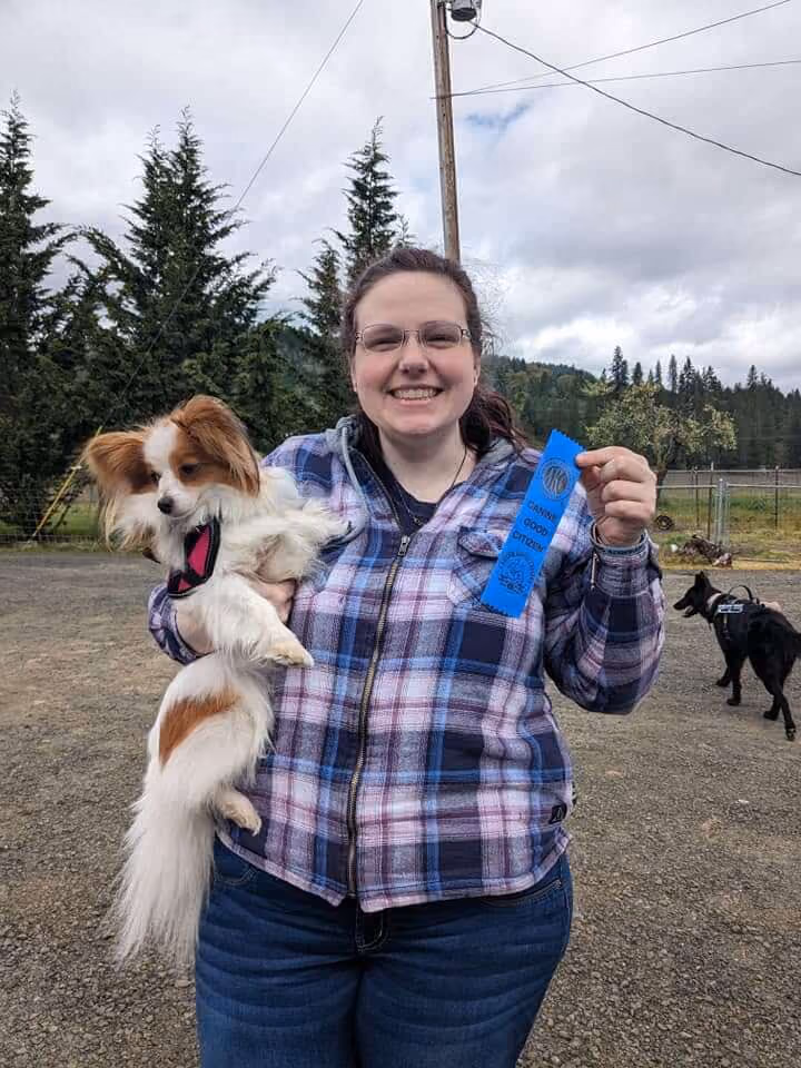 Frankly Dog Training client with a ribbon.
